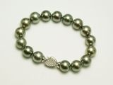 Tahitiperlen Armschmuck mit extravagantem Verschluss aus Weissgold mit Brillanten.